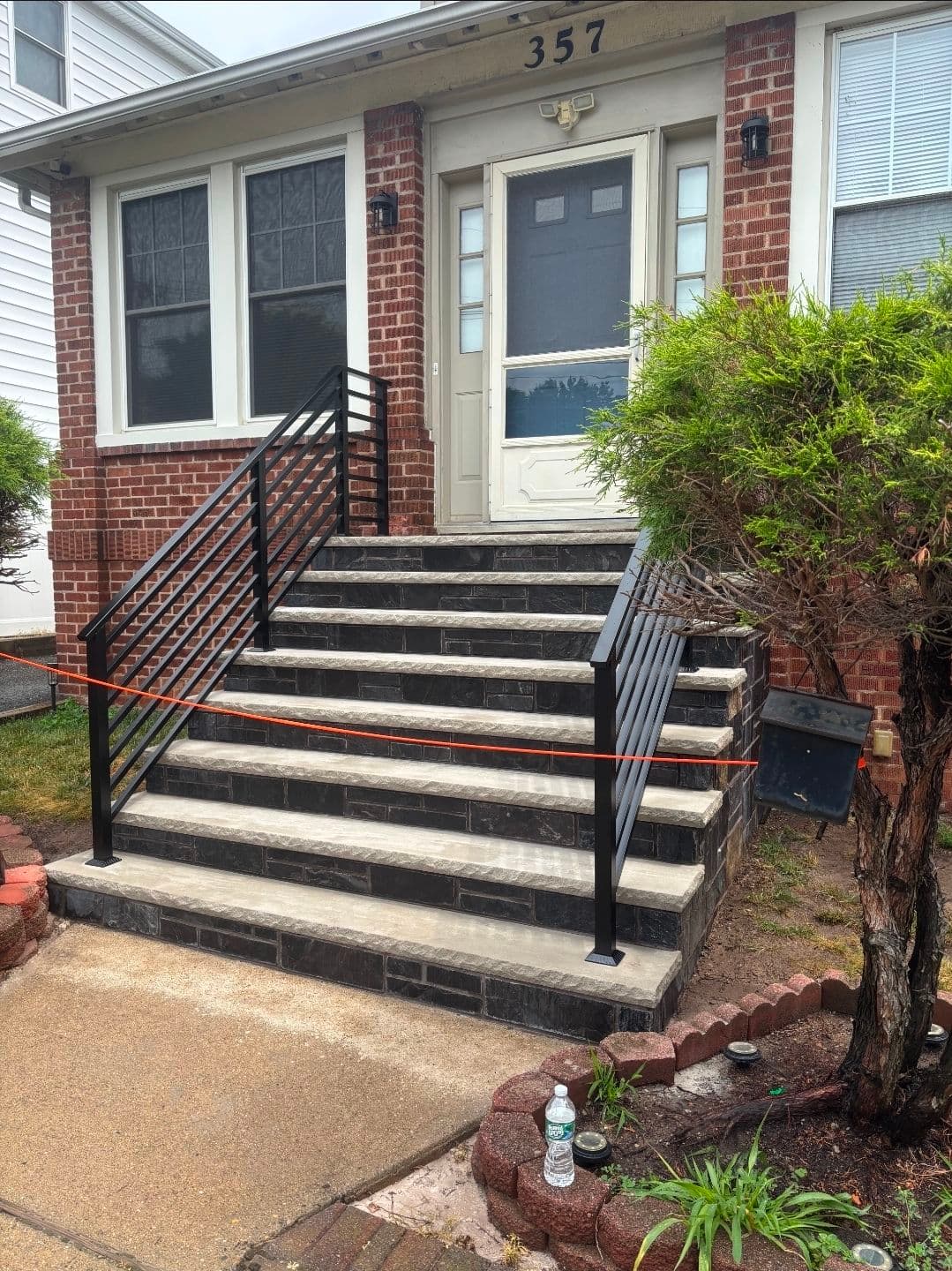 Modern Horizontal Steel Railings for a Front Entry Staircase image