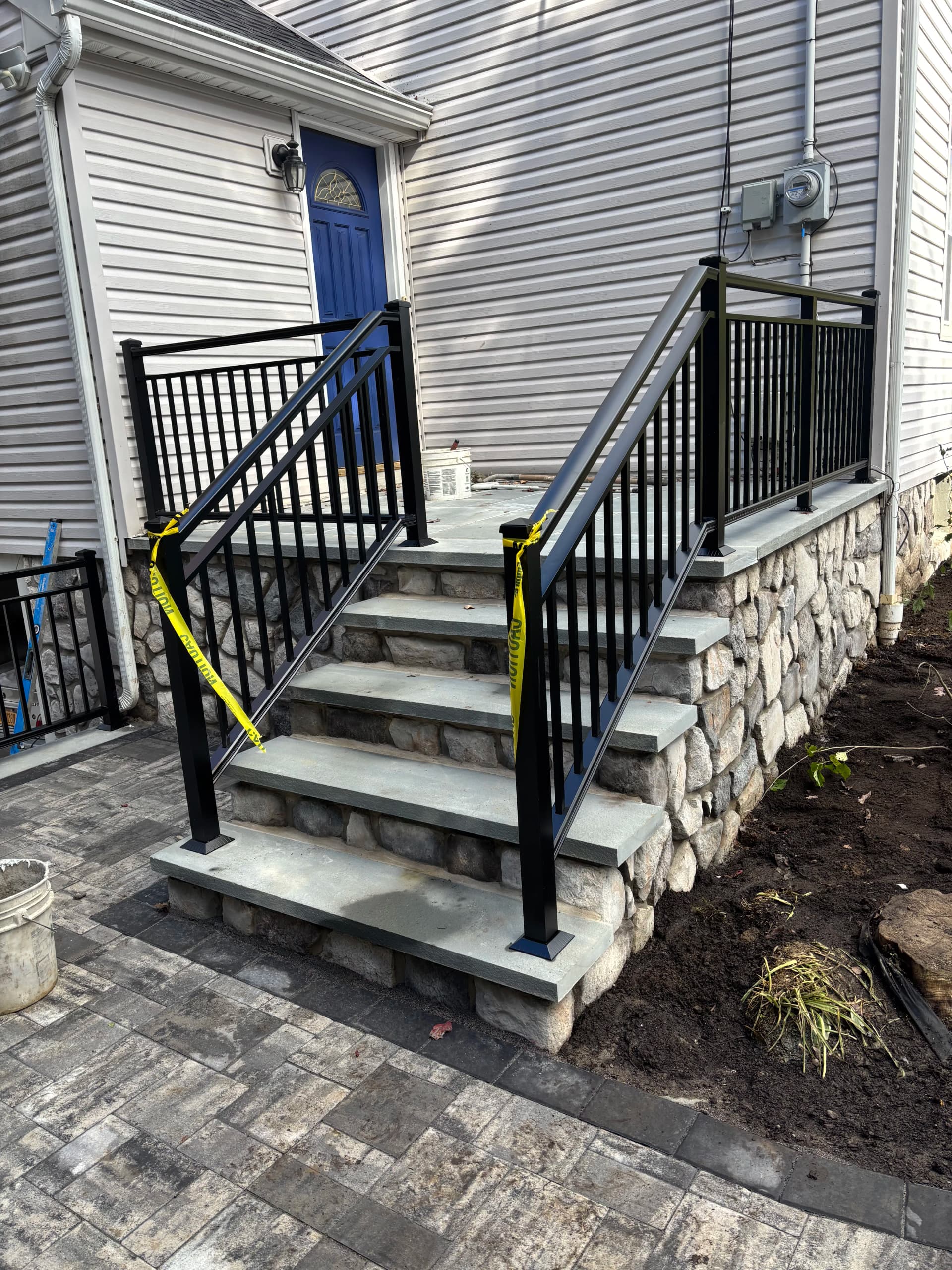 Gallery photos for Black Powder-Coated Aluminum Railings on a Stone Entry Staircase: Image #1