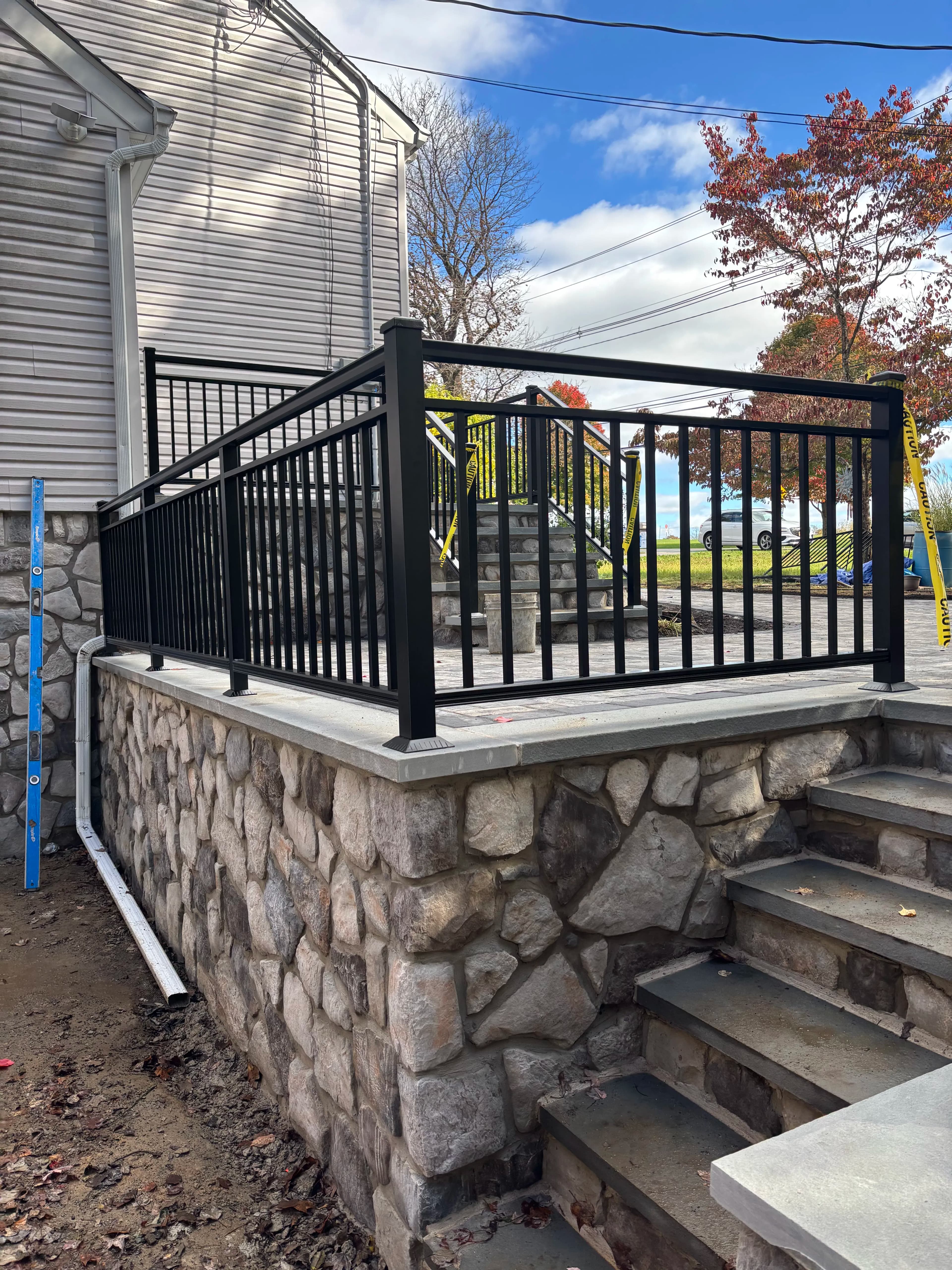 Project Black Powder-Coated Aluminum Railings on a Stone Entry Staircase image