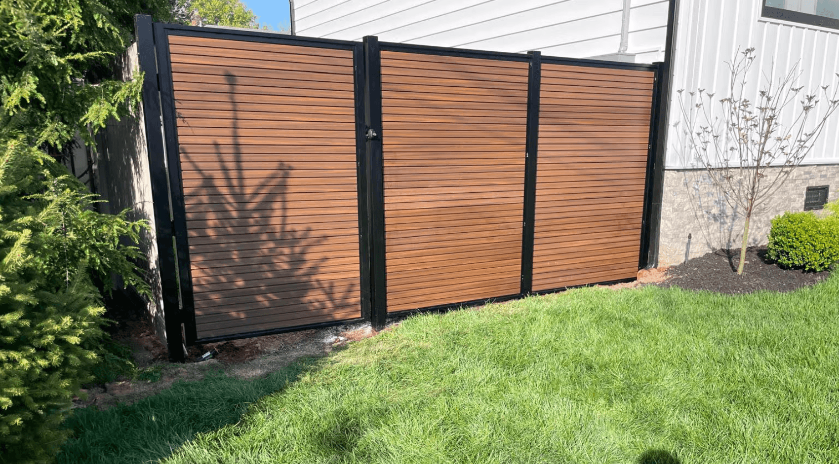 Wood Panel and Black Aluminum Fence Installation in Ridgefield NJ image